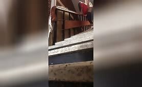 MEXICAN COUPLE ON BUILDING STAIRS 