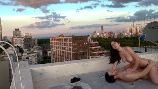 This hot brunette babe fucks her horny boyfriend on the roof
